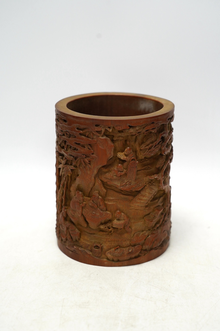 A Chinese carved bamboo 'scholars' brushpot, 15.5cm tall. Condition - fair to good